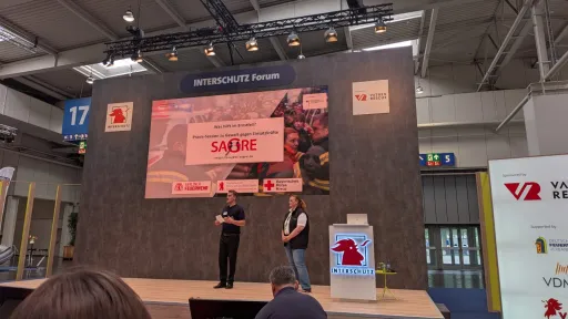 Michaela Selzer und Leopold Scholze beim INTERSCHUTZ Forum